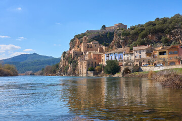 Fototapeta na wymiar Village and knights templar castle of Miravet at the banks of river Ebro in Catalonia, Spain