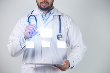 Close-up of male doctor holding tablet pc with glowing medical icons