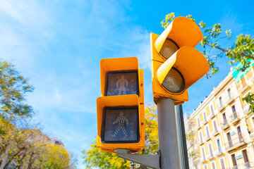 Yellow retro traffic light in the city 