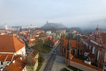 Aerial beautiful spring morning fog view of Vilnius Old Town, St. Anne's Church, Lithuania