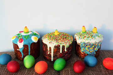 Traditional Easter baking. Easter cake and colored eggs. Close-up