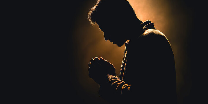 A man prays with his hands folded, generative AI.
