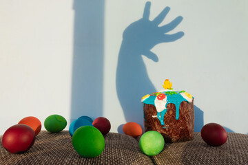 Traditional Easter baking. Easter cake and colored eggs. Close-up