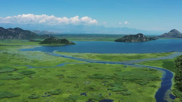Aerial view of beautiful Skadar Lake between mountains at summer, Montenegro, 4k