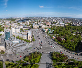 Aerial panorama on Svobody Square with historic buildings with sunset sky. Kharkiv, Ukraine in spring
