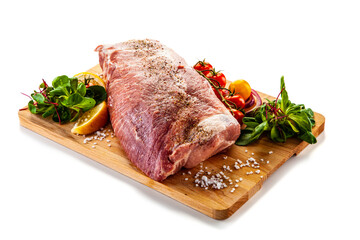 Fresh raw pork neck on cutting board on white background

