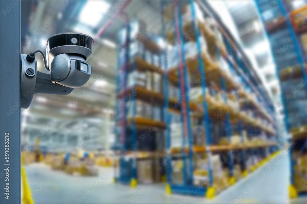 Poster closed circuit camera multi-angle cctv system against the background of a modern warehouse complex. 