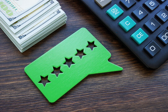 Cash, Calculator And Good Five Stars Rating. Credit Union Reviews Concept.