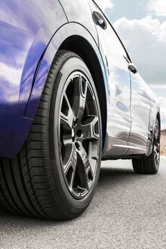 Car on sky background. Car wheels close up on a background of as