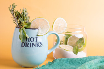 lime and mint with sugar in a glass jar. Tincture for fragrant green tea, Hot healthy drink in a cup