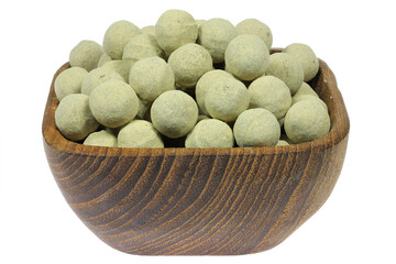 salmiak hagel candies in a wooden bowl isolated on white background