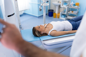 Medical equipment. Doctor and patient in the room of computed tomography at hospital.Doctor examining patient with CT scanner. Computerised tomography.