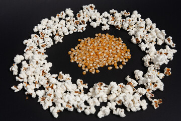 A pile of corn kernels in the middle of a ready-made popcorn circle.