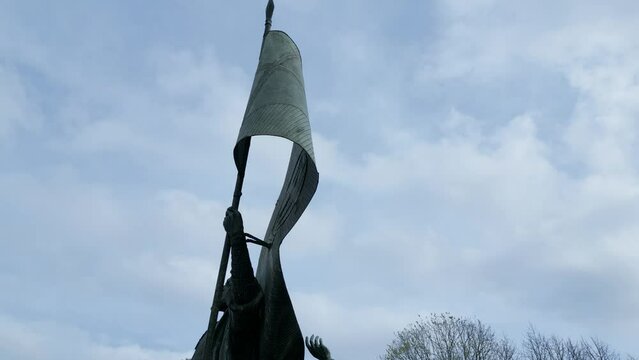 amazing view of  statue honoring Pedro Alvarez Cabral stands against the backdrop of a cloudy sky