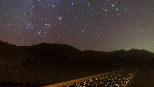Railway at Night
Starry night sky time lapse milky way galaxy and shining star over dark black nature in desert
Iron stone mine metal working manufactory steel industry
silhouette hills parallel lines 