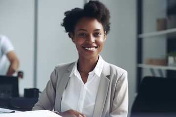 Professional-looking, smiling young woman in a business setting