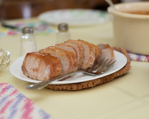 sliced pork roast on the table ready for a family dinner