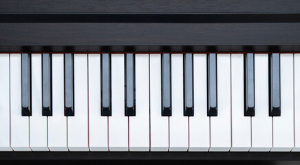 Black and white piano keys, taken from above. Flat top view. Horizontal photo