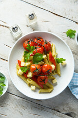 Pasta with baked tomatoes and cheese