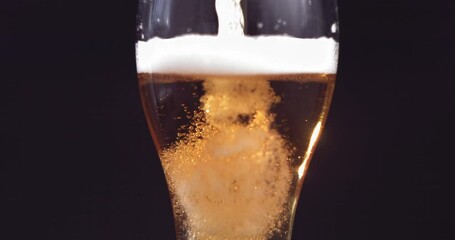 Slow motion of pouring beer into the glass
