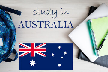 Fototapeta na wymiar Study in Australia. Background with notepad, laptop and backpack. Education concept.