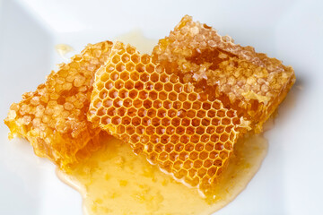 Sweet honeycomb isolated on white bee products with organic natural ingredients concept