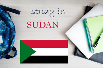 Study in Sudan. Background with notepad, laptop and backpack. Education concept.