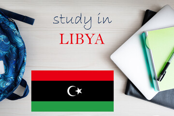 Study in Libya. Background with notepad, laptop and backpack. Education concept.