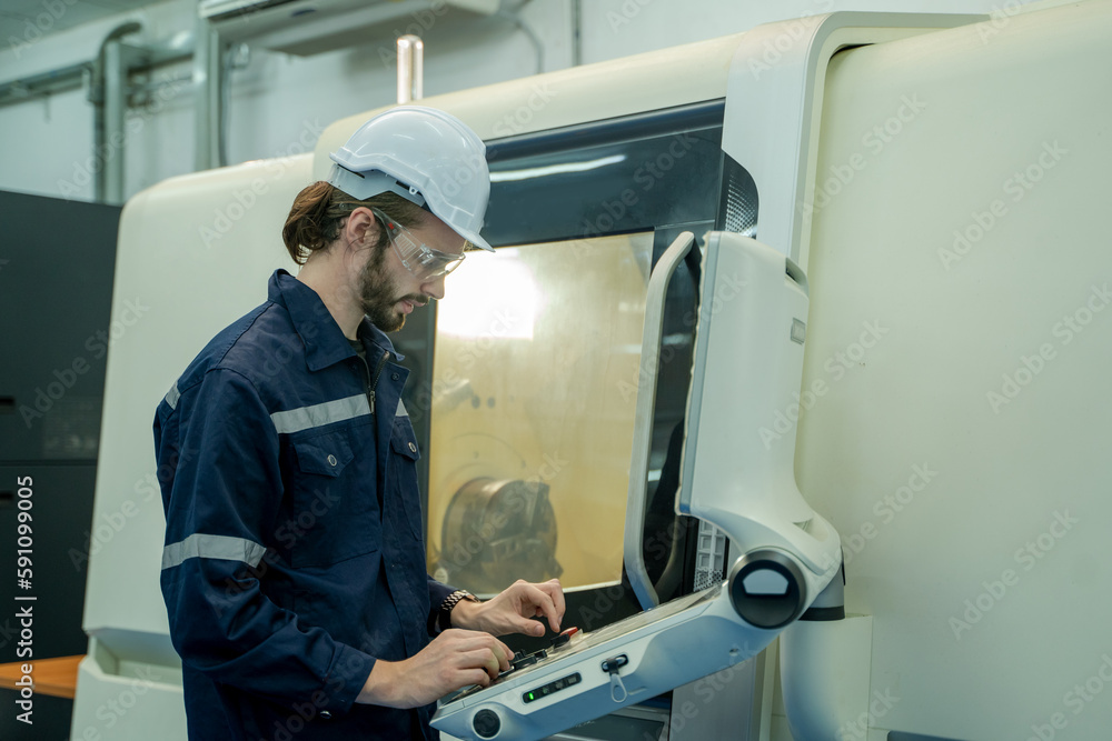 Poster Engineer operating CNC computer machine working in industry factory.