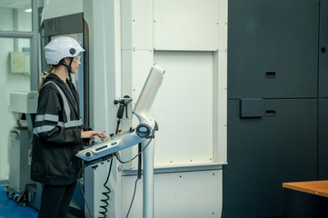 Engineer operating cnc machine in control panel at factory,Industry 4.0 concept.