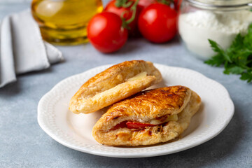 Obraz na płótnie Canvas Tomato Cheese Pie. Boyoz with tomato and cheese from traditional Turkish cuisine. Turkish name; domatesli boyoz.