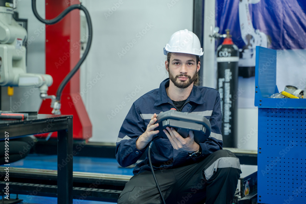 Poster Robotics industry concept,Robotics control engineers setting and maintain spare parts of industrial robot arm controller in production plant factory.