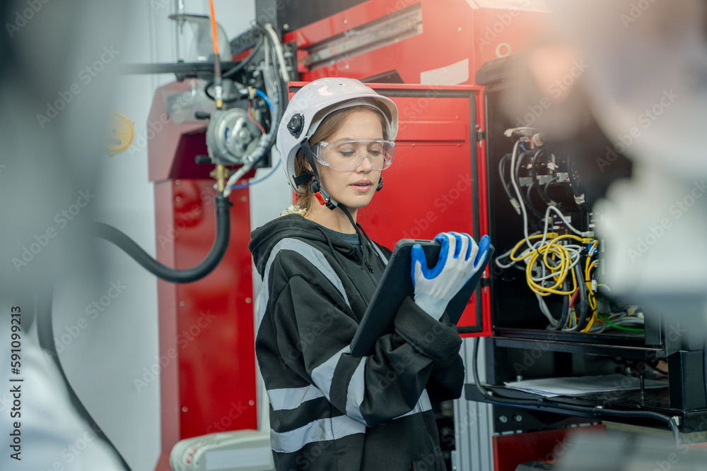 Leinwandbilder engineer working with automation robot arms machine in intelligent factory industrial.