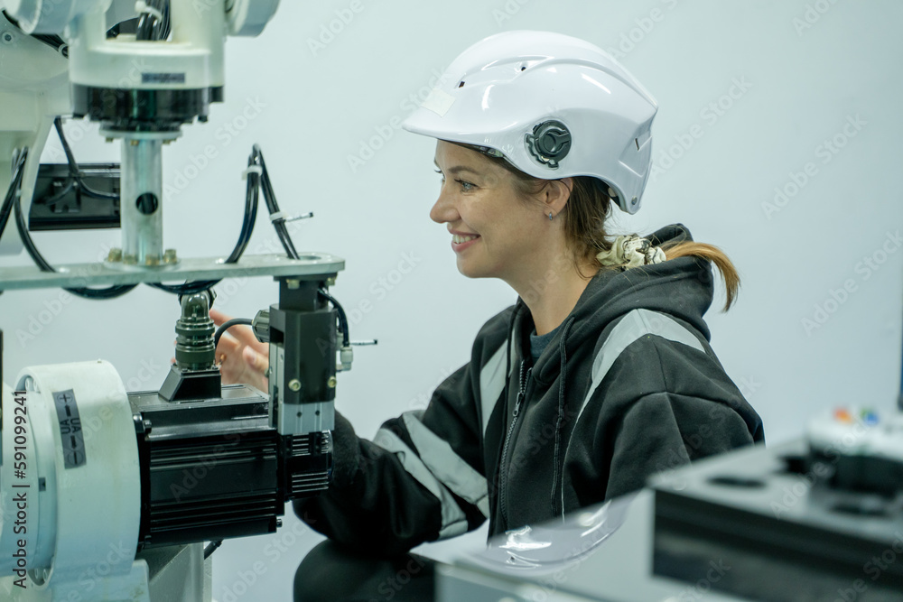 Fototapete technical engineer working with adept robotic arm in a workshop,industrial robot programming softwar