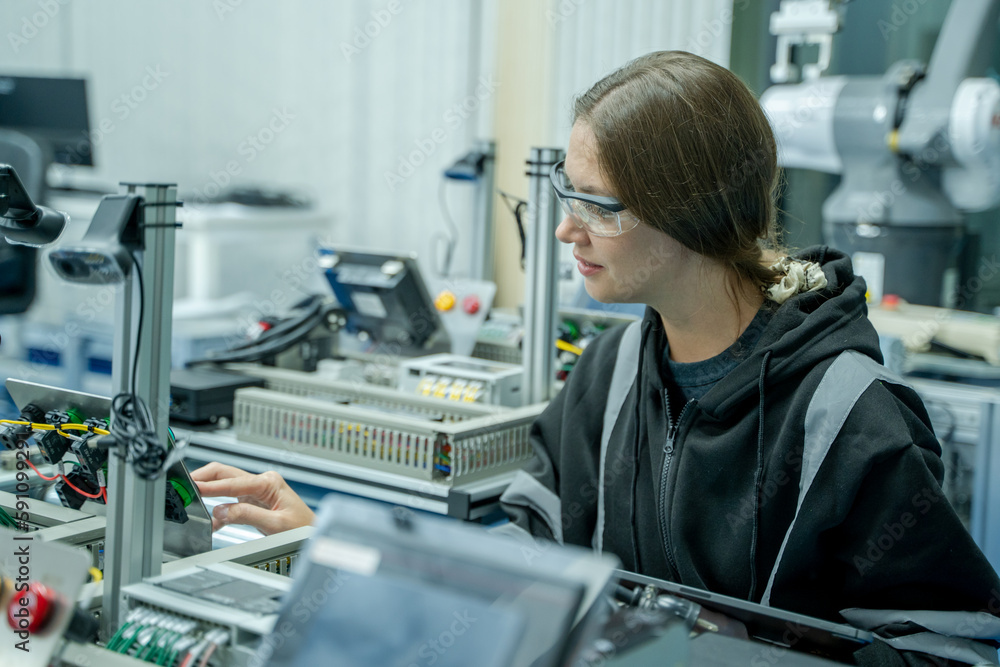 Fototapete engineer working with optimization of robot arm,doing robotic maintenance ideas.