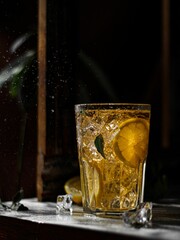 Vertical shot of a cocktail with lemon