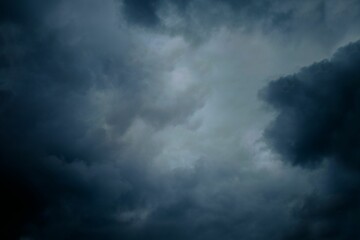 Naklejka na ściany i meble Beautiful shot of large clouds in a dark stormy sky