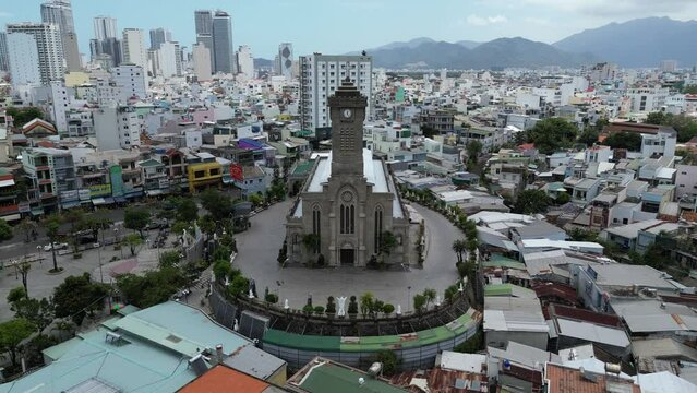 Ascending drone footage above the beautiful Cathedral of Nha Trang, Khanh Hoa province, Vietnam. Located on a small hill in the heart of the city, the structure was built in 1928 during french era 2-2