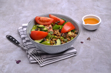Salad slices of raw vegetables with lentils