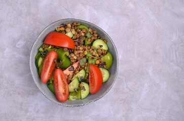 Salad slices of raw vegetables with lentils