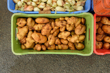 Potatoes and onions at the street market.