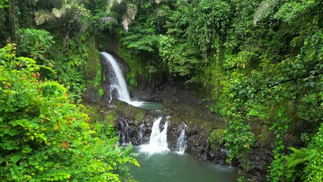 Pengibul Waterfall. The uniqueness of Pengibul Waterfall is that this waterfall is multilevel. The waterfall at the top level has a height of about 15 meters. Bali.
