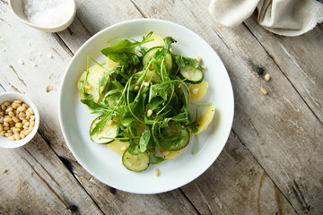 Potato salad with cucumber and arugula