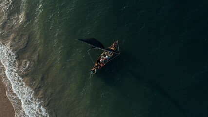 Drone shot of small fishing boat on the sea