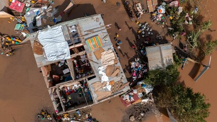 Naklejka na ściany i meble Aerial of the poor population of Africa living in old buildings during the flood