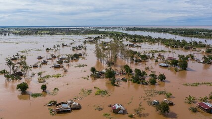 Aerial view of the flooded village in Mozambique after a cyclone. - obrazy, fototapety, plakaty