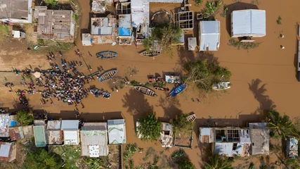 Fotobehang Afrika Aerial of the poor population of Africa living in old buildings during the flood  © Bruno Pedro/Wirestock Creators