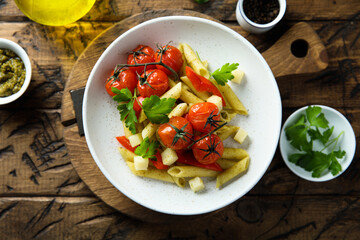 Pasta with baked tomatoes and cheese