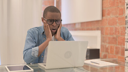 African Man Shocked by Loss on Laptop