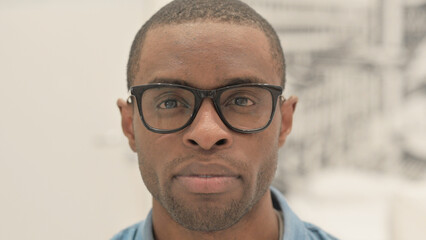 Close Up of Serious African Man Looking at Camera